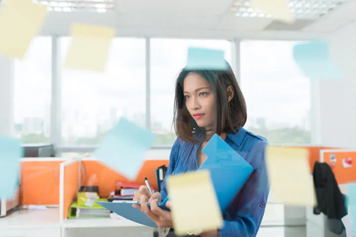 Woman using post-it notes