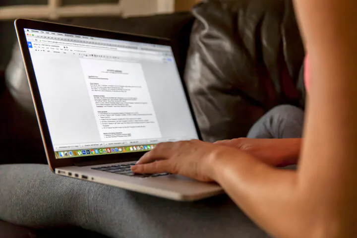 Woman-editing-resume-on-laptop