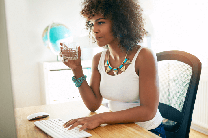 woman-drinking-water-home-office