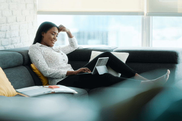 woman working from home on couch