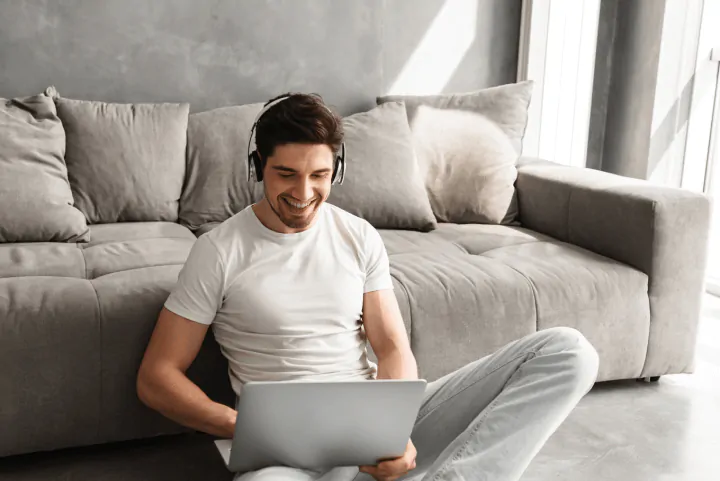 man taking online course at home on laptop