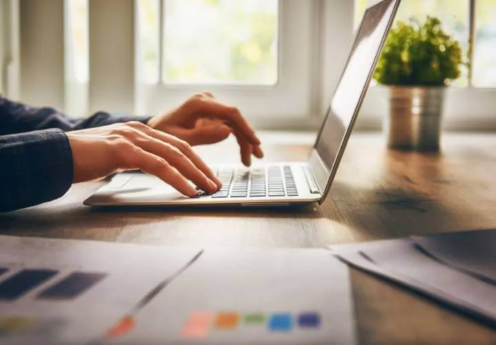 man using laptop at home