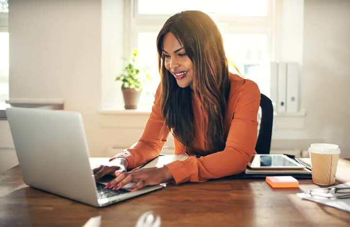 woman learning using laptop at home