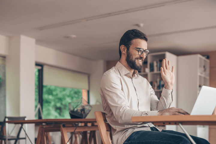 man on video conference call at home