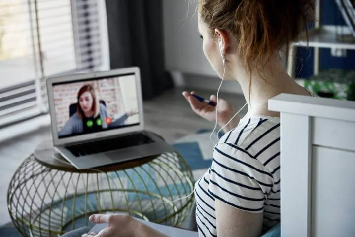 woman learning with coworker online