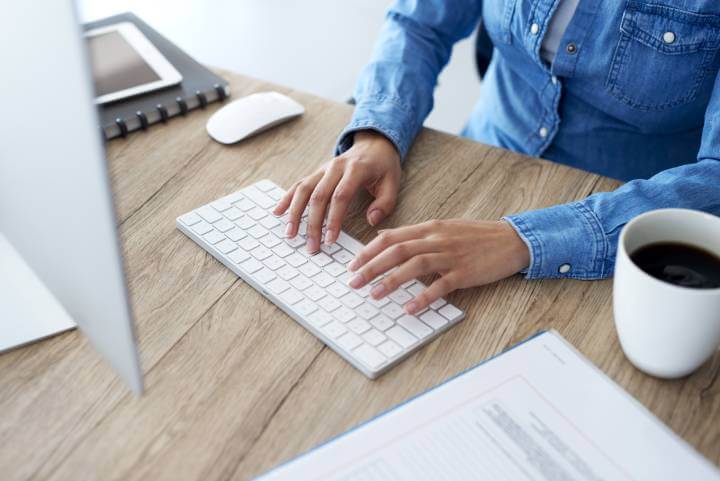 woman typing on keyboard