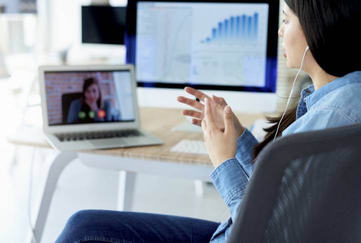 woman on video call in brightly lit room