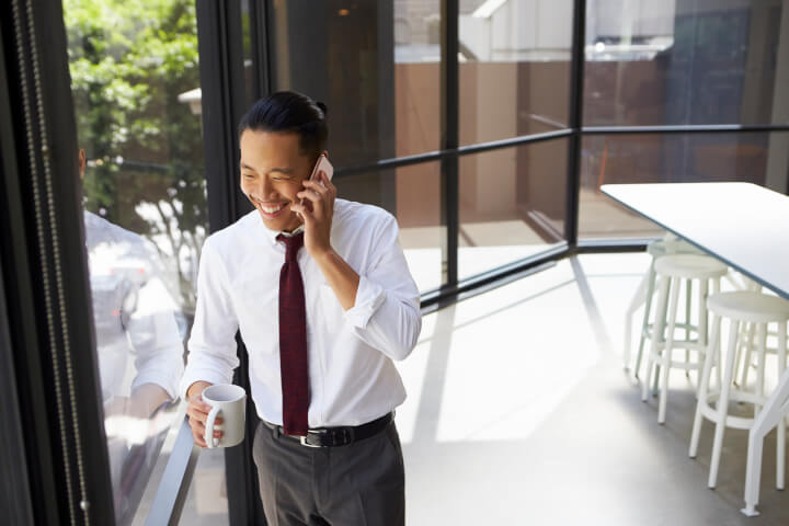 cyber security expert on phone at work