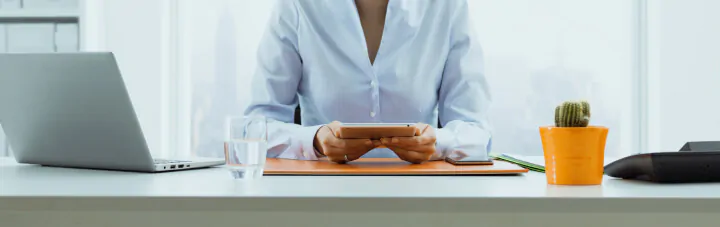Woman on tablet at desk