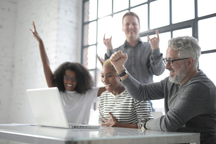 Group of employees having fun while learning online